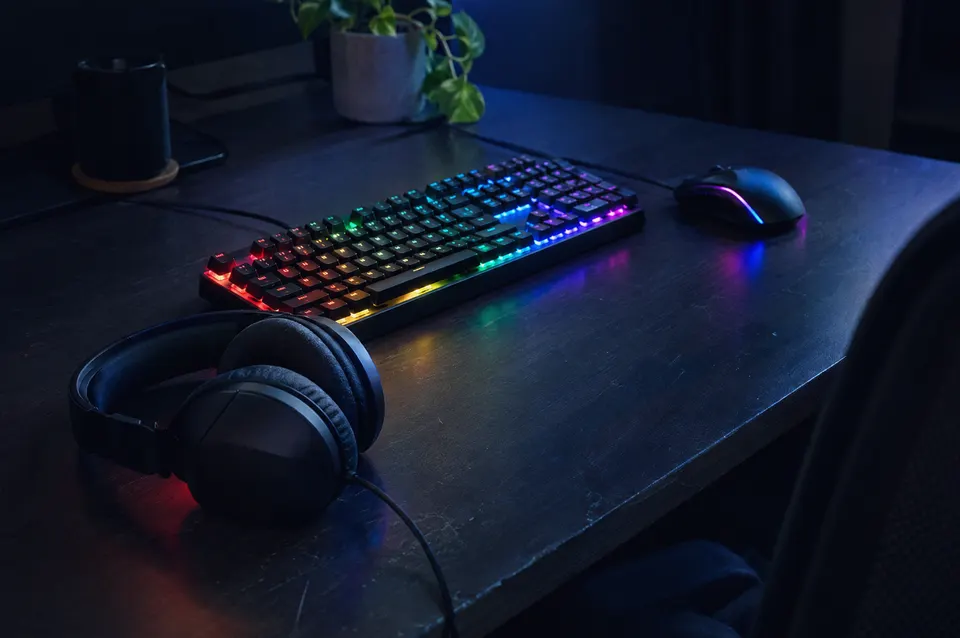 Illustration: A gaming desk lit with colourful light