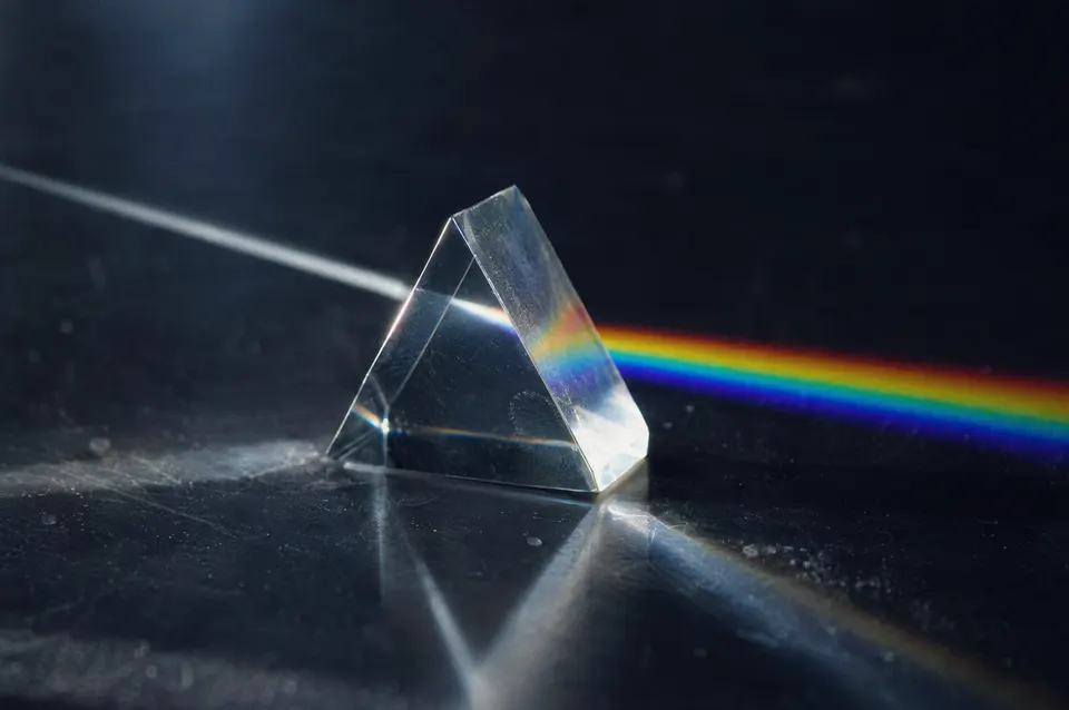Illustration: Light splitting into colours through a prism